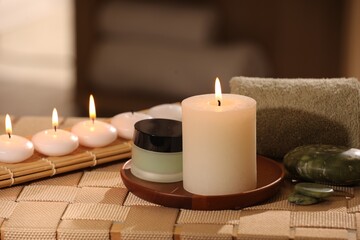 Beautiful composition with different spa products on wicker bench indoors