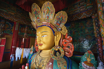 The statue of Maitreya Buddha at Thiksey Monastery in Ladakh - obrazy, fototapety, plakaty