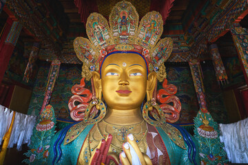 The statue of Maitreya Buddha at Thiksey Monastery in Ladakh - obrazy, fototapety, plakaty
