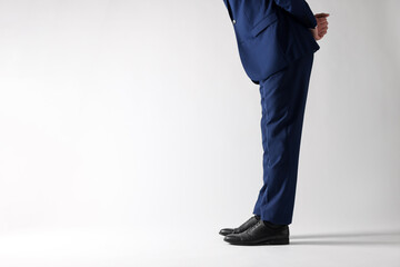 Businessman in leather shoes on white background, closeup