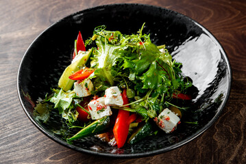greek salad with cheese, tomato, olive, pepper, onion