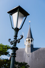 Close up of a classic standing street light in the village Oudenhoorn in the Netherlands. The...