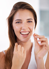 Happy, dental and portrait of woman with floss for health, wellness and clean routine for hygiene. Oral care, smile and female person with dentistry tool for teeth or mouth treatment in bathroom.