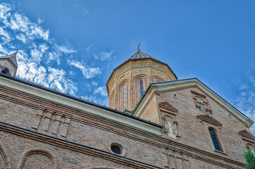 Temple of the Georgian Orthodox Church on a background of blue sky