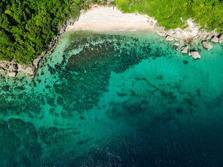 Aerial view of greenish water in coastal area with rocks. Carabao Island, San Jose. Romblon. Philippines.