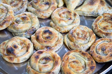 Vintage Oven Delights: Delectable Stuffed Pastries Await Baking in the Old Oven, A Culinary Tradition