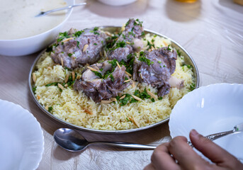 mansaf and jameed served on table, with copy space
