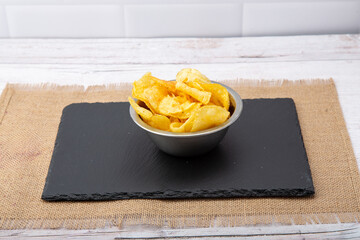 A hand reaching for thin-cut fries, capturing the anticipation of crispy delight and savory satisfaction in every bite