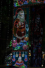 LED light Santa clause against black background.