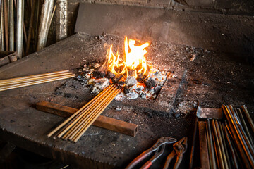 blacksmith workshop metal heating in charcoal fire