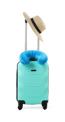 Soft travel pillow and hat on turquoise suitcase isolated on white