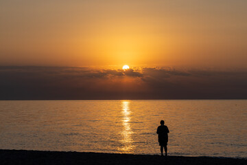 Sunrise over the Mediterranean Sea seen from the beach in Torremolinos. Costa del Sol, Spain