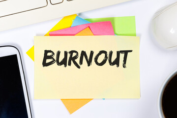 Burnout ill illness stress stressed at work business concept on a desk