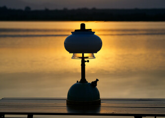 Light an oil lamp at dusk in the swamp.