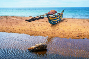 Fishing boat with fishing net on beach with bird, Sri Lanka. - 752280718