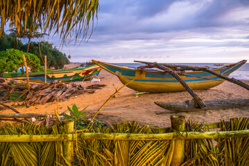 Old fishing boats on sand of Waskaduwa beach, Sri Lanka. - 752280736