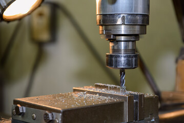 The slot cutting  process on NC milling machine with flat end mill tools.