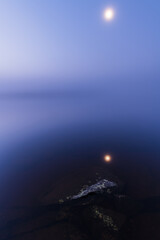 Serene Moon Over Misty Swedish Lake at Twilight