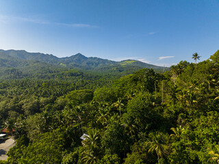 Fototapeta na wymiar Mountains and green hills in Philippines. Slopes of mountains with evergreen vegetation. Mindanao. Philippines.
