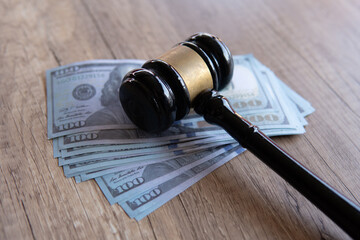 Closeup image of gavel and money. Fine, penalty, bribe concept.
