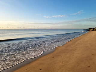 Sea, and blue sky with clouds and waves on the beach along the coast of the Gulf of Thailand.