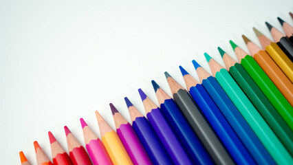 Set of colored pencils on a white background That is arranged in a bar graph, Color pencils on white background, Close up, seamless colored pencils row with wave on lower side, line pencils.