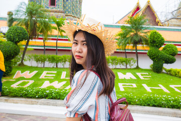 Beautiful tourist asian woman backpack travel walking in buddha temple sightseeing - 752295716