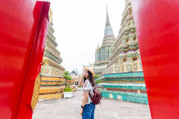 Beautiful tourist asian woman backpack travel walking in buddha temple sightseeing - 752296958