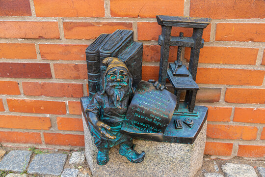 Sculpture of dwarf (gnome) from fairy-tale in a sunny day, Wroclaw, Poland