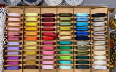 Colorful ribbon or multicolored shoelaces display, overhead shot.