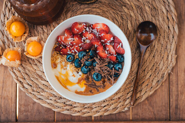 Oatmeal topped with fruit yogurt Chocolate and bee pollen