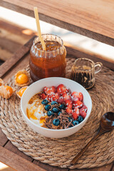 Oatmeal topped with fruit yogurt Chocolate and bee pollen
