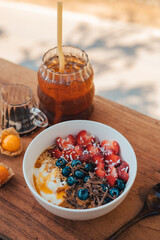 Oatmeal topped with fruit yogurt Chocolate and bee pollen