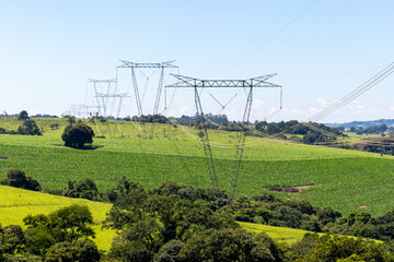 High voltage power towers on a farm