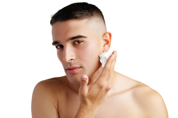Young handsome man applying shaving foam against white background