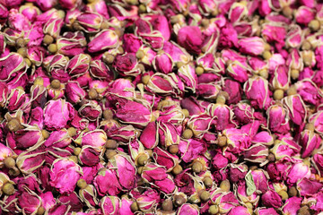 Dry roses for herbal tea, purple flowers for background