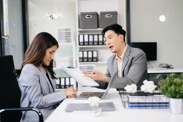 Furious businesspeople arguing strongly after making a mistake at work in office.