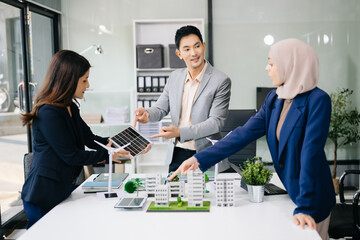 Fototapeta premium Business people having consultation about wind energy at company office. Business team discussing about windmill and alternative green energy. Executive meeting at modern office.