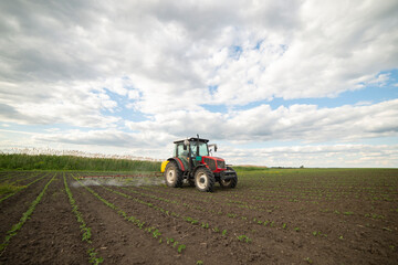 Spraying pesticides at soy bean fields