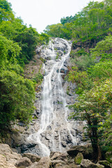 Sarika Waterfall, Khao Yai National Park, Thailand. During the summer there are not many waterfalls flowing down. Surrounded by green trees that grow close to the waterfall.