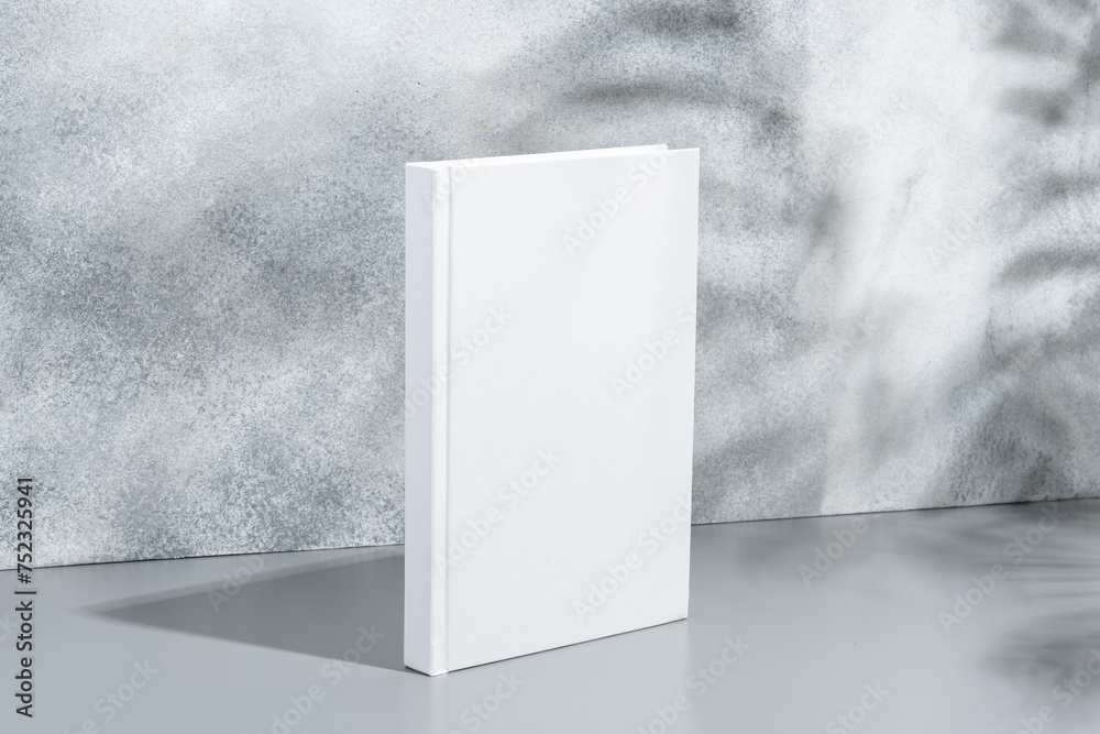 Sticker White blank book with hard cover on gray background with shadows