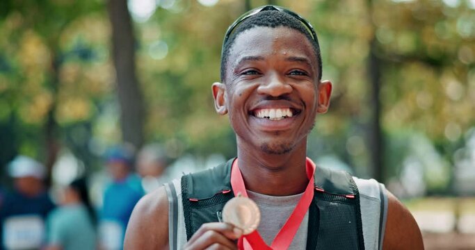 Black man, sportsman and happy face with medal for winning or success, marathon and long distance running. Athlete, achievement and victory for track outdoors, pride and fitness for sprinting race