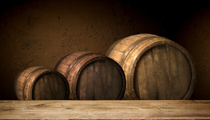 Three hardwood barrels, tinted in shades of oak, sit atop a wooden table at the winery event. The natural material blends with the metal circle accents and wood stain finish