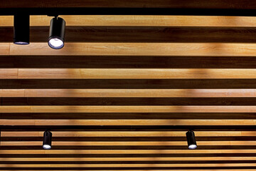 abstract modern wooden surface with lamps in modern interior