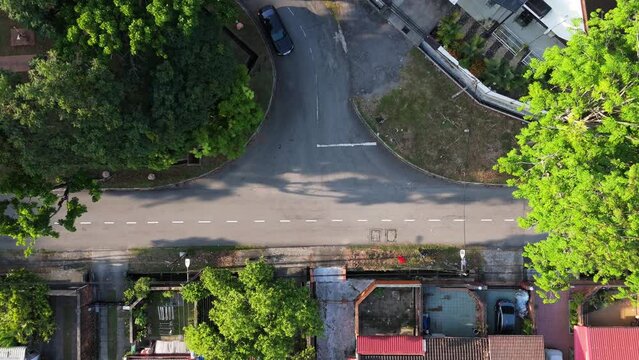 Top view drone shot of t-junction in rural area of city