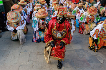 Dancers in traditional costumes at the festivity of the Virgen del Carmen, Paucartambo square,...