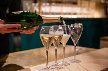 Tasting of sparkling wine champagne on winter weekend festival in December on Avenue de Champagne,...