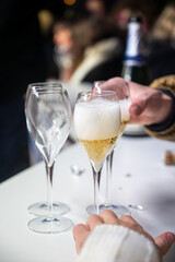 Visitors drink of sparkling wine champagne on outdoor winter festival in December on Avenue de Champagne, Epernay, Champagne region, France