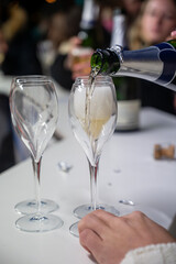Visitors drink of sparkling wine champagne on outdoor winter festival in December on Avenue de Champagne, Epernay, Champagne region, France