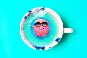 Happy Brain in Sunglasses Floats in a Coffee Cup